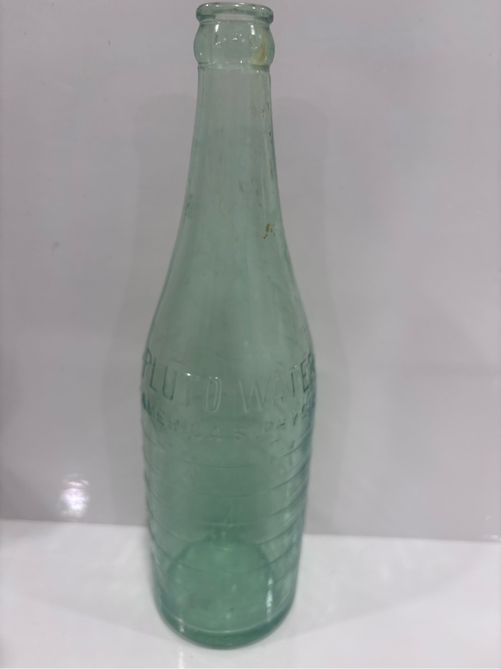 Vintage embossed Pluto water aqua glass -americas physic- mineral water